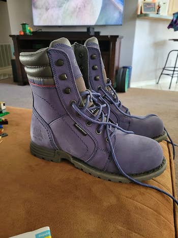 reviewer photo of purple waterproof steel-toe boots