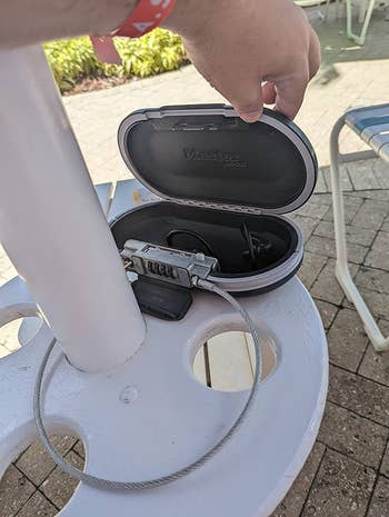 A reviewer's black safe attached to an umbrella