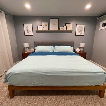 reviewer photo of wooden platform bed in bedroom