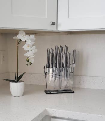 reviewer's knives in minimalist white kitchen 