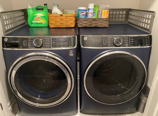 a reviewer photo of the gray laundry guard on a washer and dryer