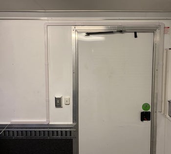 Reviewer's cord covers concealing wiring around a door