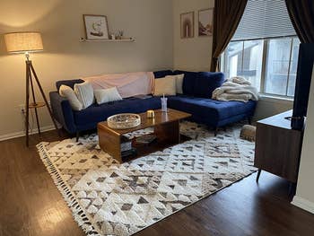 reviewer image of the ivory/brown rug in a living room