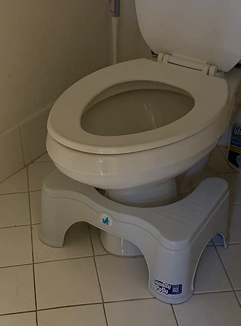 a reviewer photo of the stool in front of a bathroom 