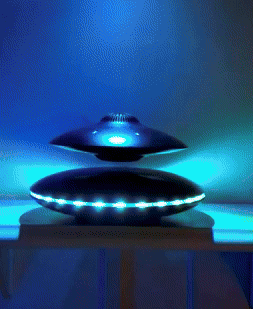 gif of reviewer's levitating, spinning speaker with changing LED lights