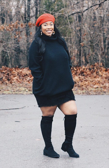 reviewer wearing the black dress