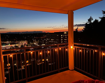 another reviewer's globe lights strung on a balcony