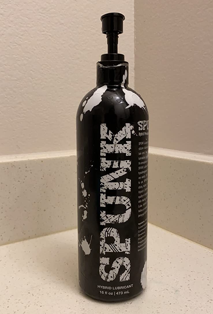 Black and white bottle of Spunk lubricant on counter