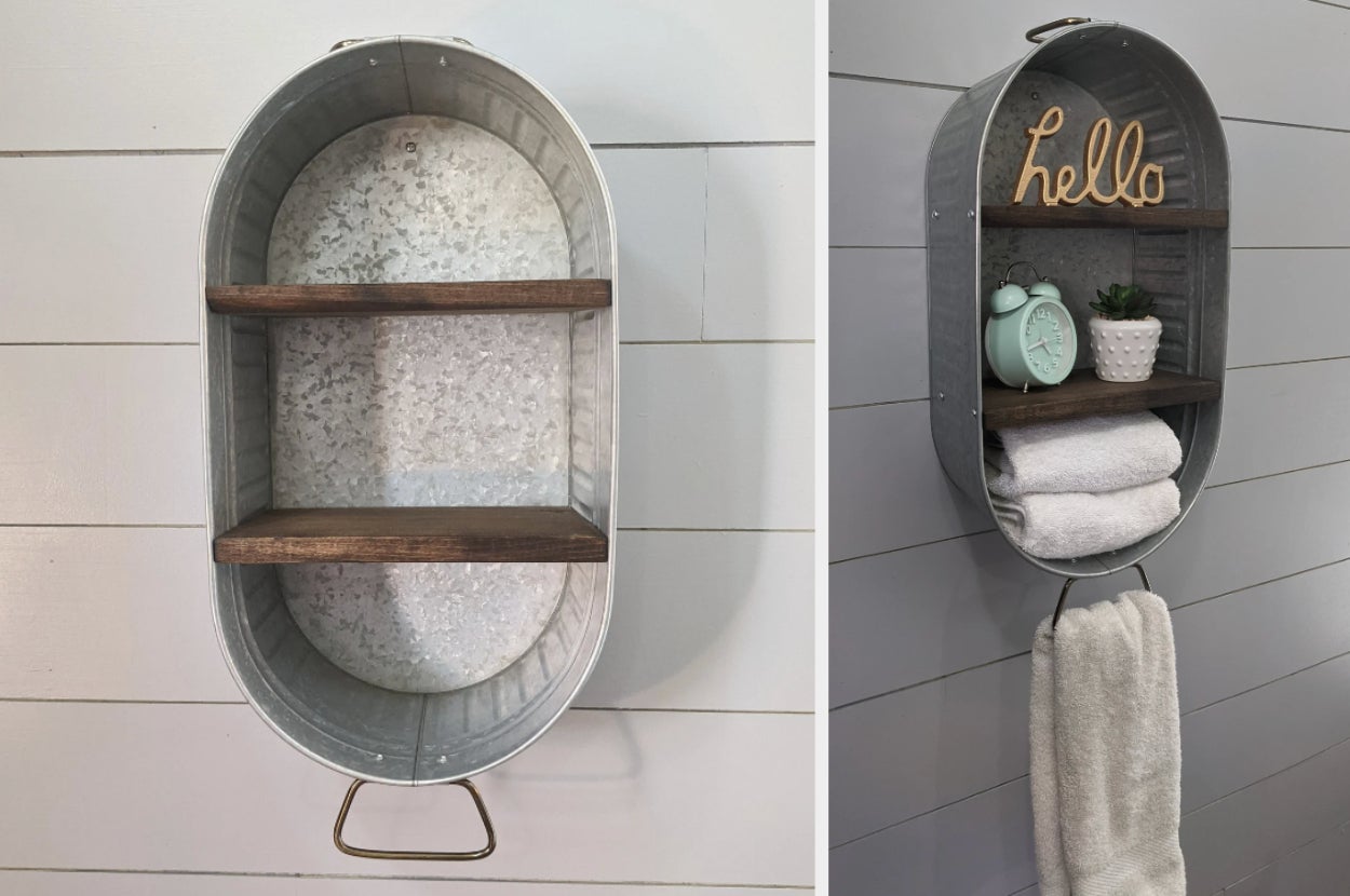 Silver washtub with brown shelves inside mounted to a white wall, product with towels and knick knacks inside