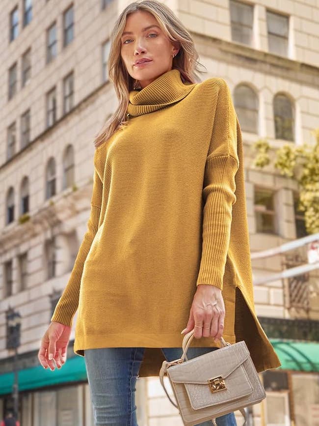 model in a yellow oversized turtleneck