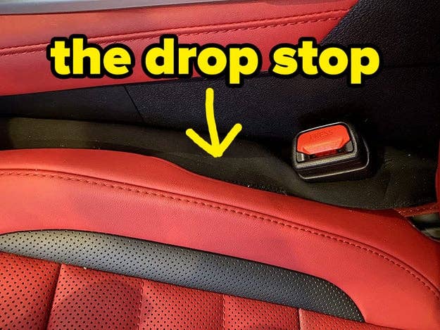 A reviewer's drop stop inserted next to their car's driver seat