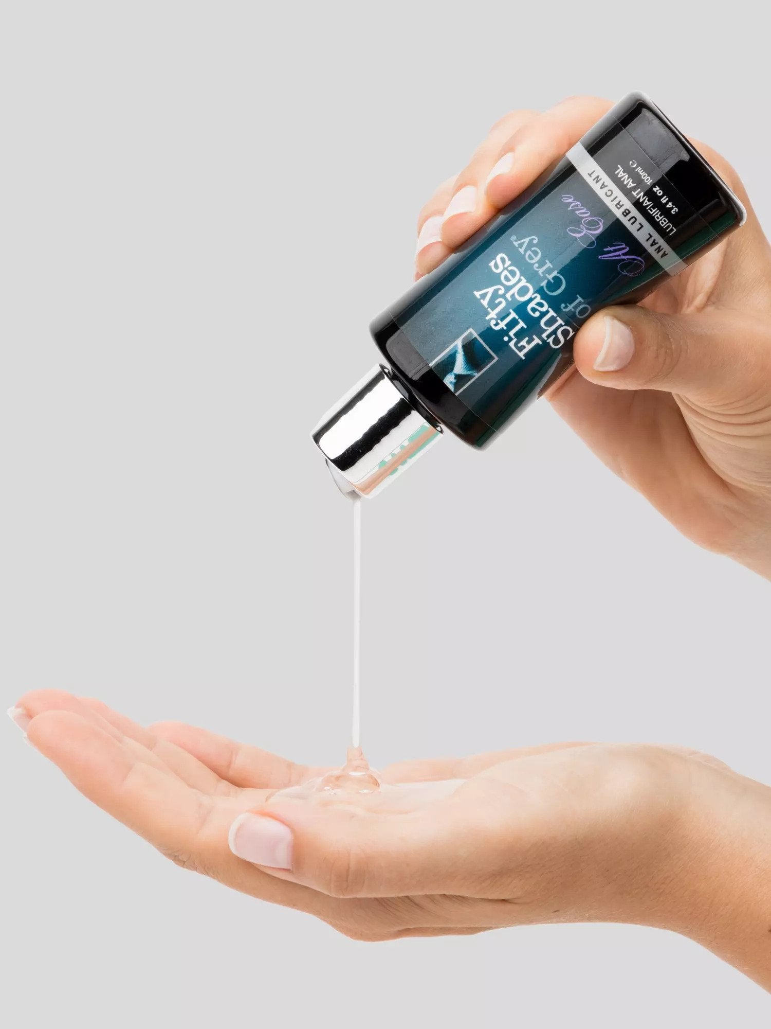 Model dispensing clear lubricant into hand