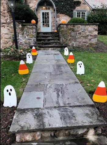 the ghosts and candy corn decor lining a walkway
