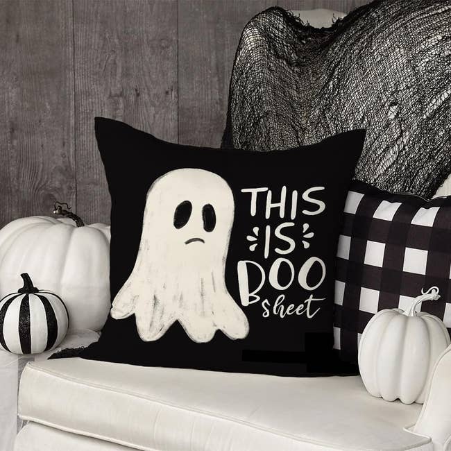 decorative pillow cover with sad illustrated sheet ghost and the phrase this is boo sheet