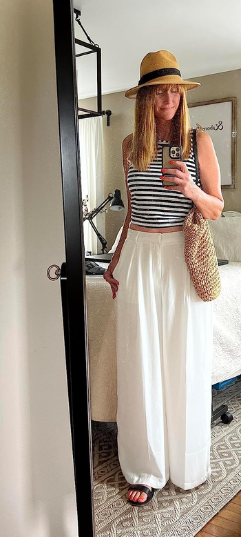 reviewer wearing the pants in white