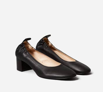 pair of black leather heels
