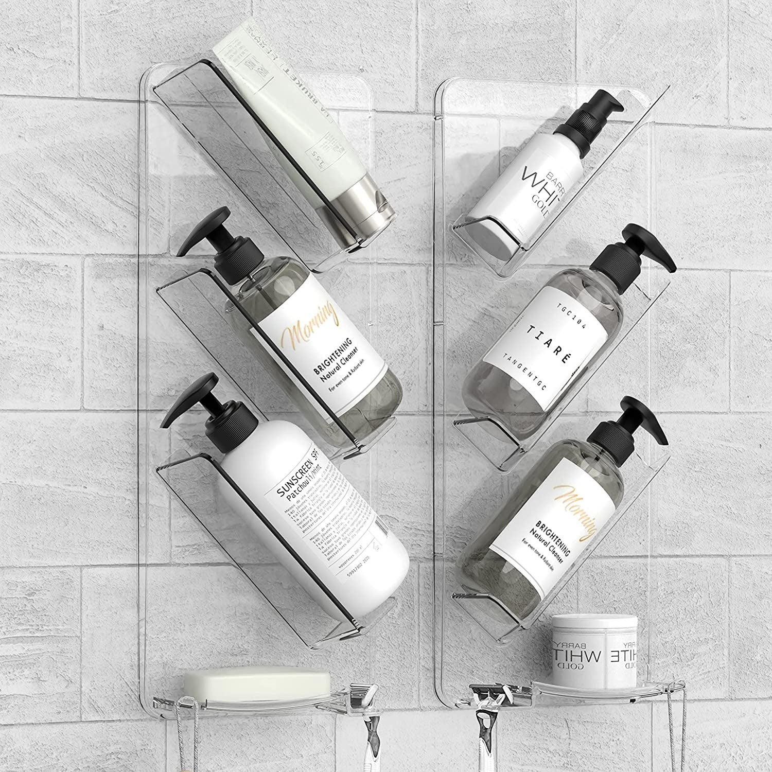 A set of six small clear shelves attached to a shower wall, tilted diagonally to each hold a bottle of shampoo 