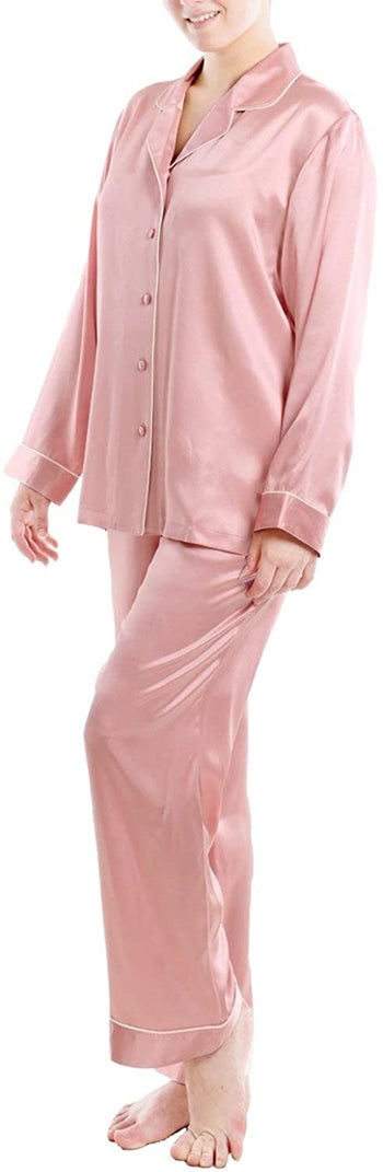 model wearing powder pink longsleeve silk pajamas