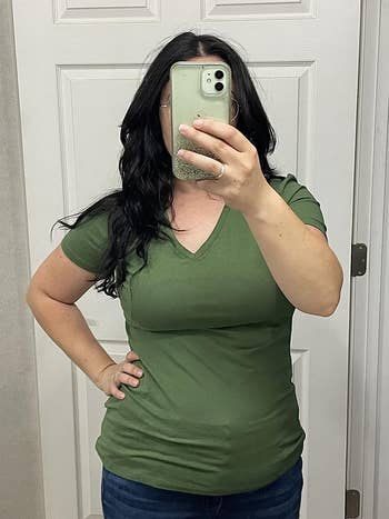Reviewer wearing the shirt in green