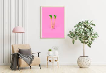 The pink digital print with girl with green heels framed and hanging on a wall