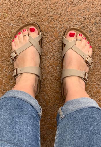 reviewer wearing the sandals in tan