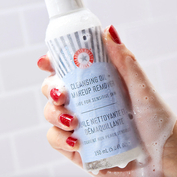 a soapy bottle of first aid beauty cleansing oil makeup remover