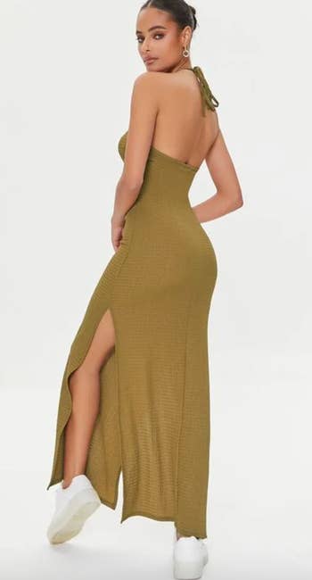 Model showing back of green dress