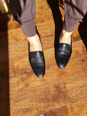 reviewer wearing the loafers in black