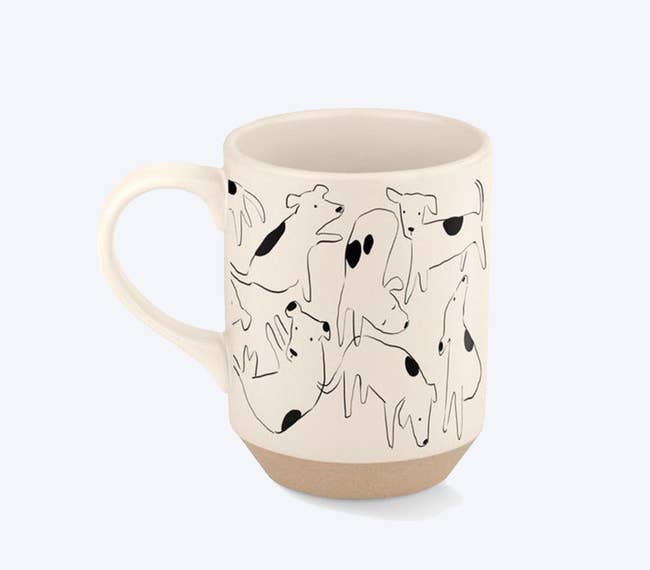 Black and white ceramic mug with dogs illustrated