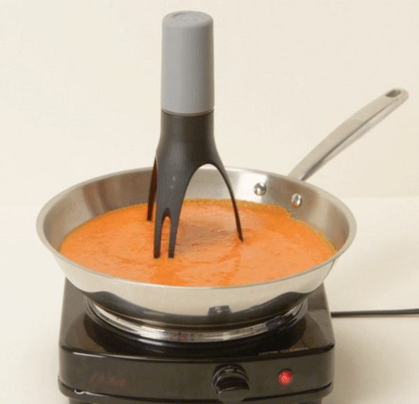 The stirrer in a pan constantly moving
