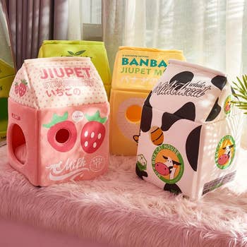four different Japanese milk carton style cat houses