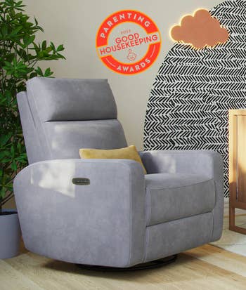 glider chair in gray in nursery with good housekeeping award stamp