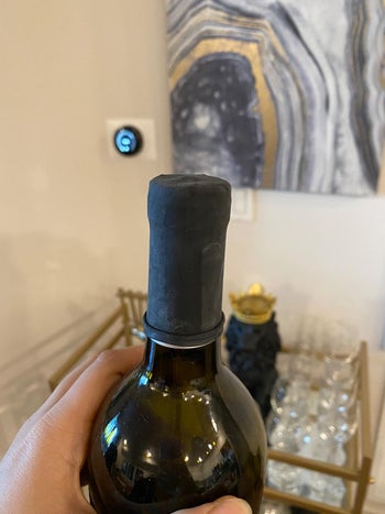 image of a wine condom sealing an open bottle of wine