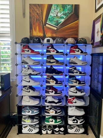 reviewer photo of sneakers in shoe rack, with lights behind them