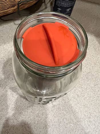 top down photo showing the orange silicone lid of the filter 