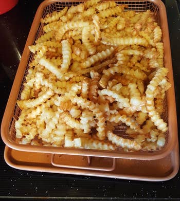 reviewer photo of crinkle-cut fries on the tray