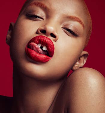 A model wearing the bright red lip