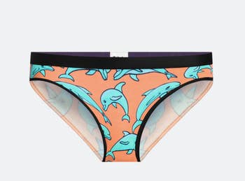 the underwear with a black waistband and orange and blue dolphin print