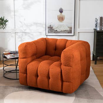 orange tufted armchair
