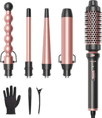 The set with two curling barrels, one curling brush, and one tapered curling wand