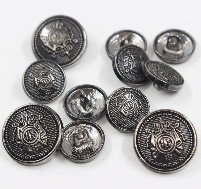 buttons with a shield motif on them