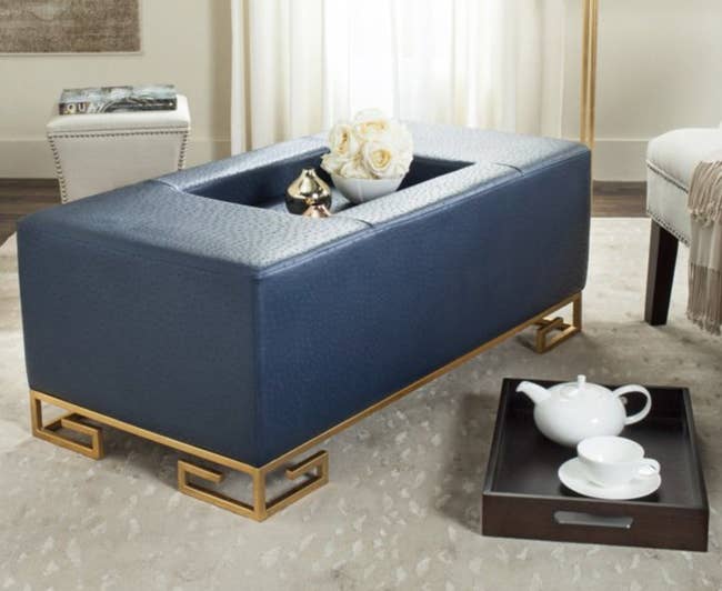 leather-looking blue rectangular ottoman with tray insert
