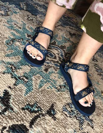 another reviewer wearing the blue sun and moon sandals