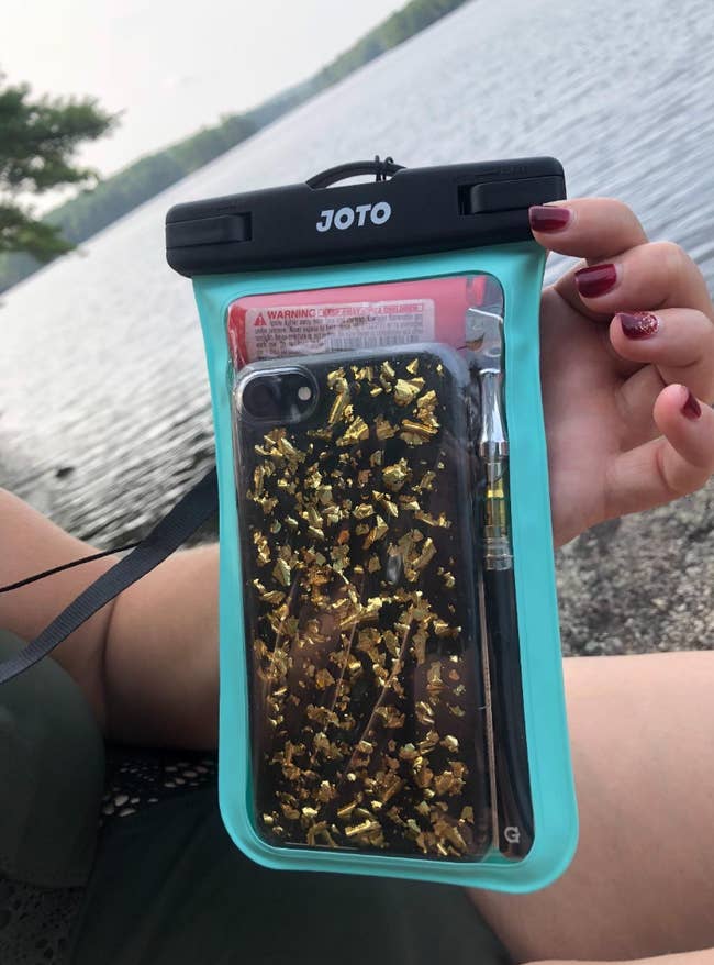 Reviewer's phone inside a transparent pouch 