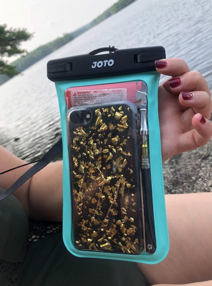 Reviewer's phone inside a transparent pouch 