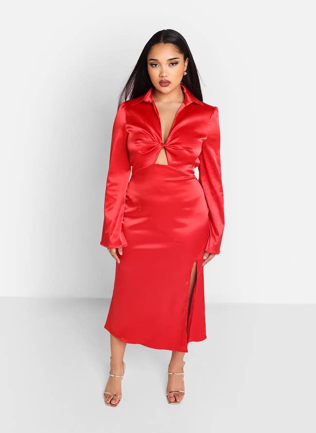 model in long sleeve collared midi dress with side slit and a twist and cutout at the bust