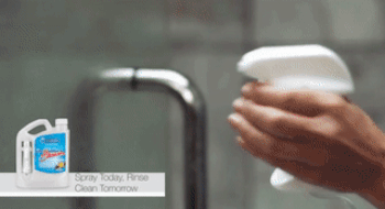 gif of person spraying shower door with cleaner and then rinsing