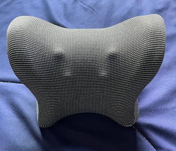 a reviewer photo of the gray pillow 