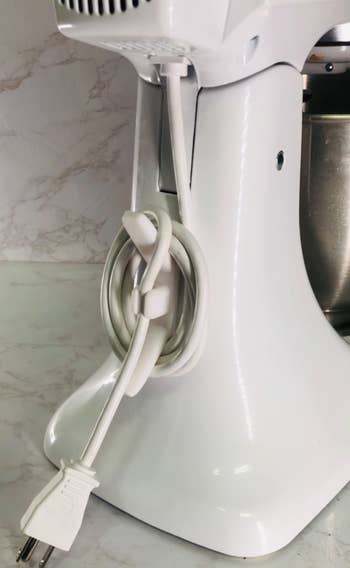Stand mixer with cord wrapped around organizer