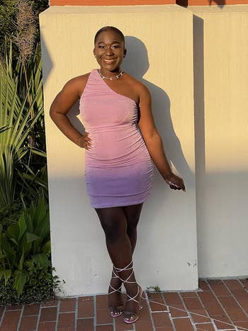 Person successful  a stylish one-shoulder formal  and strappy heels poses outdoors, perfect  for buying  manner  inspiration